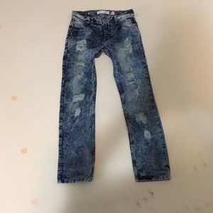 Distressed blue ripped jeans